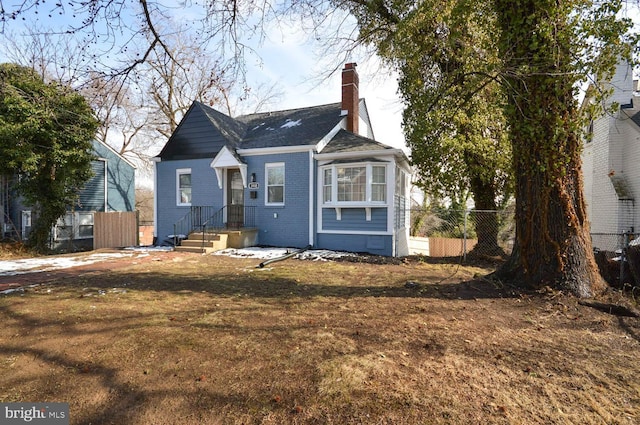 bungalow with a front yard