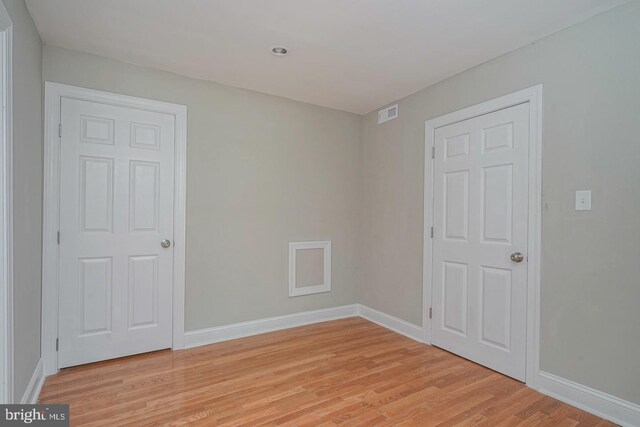 unfurnished room featuring light wood-type flooring