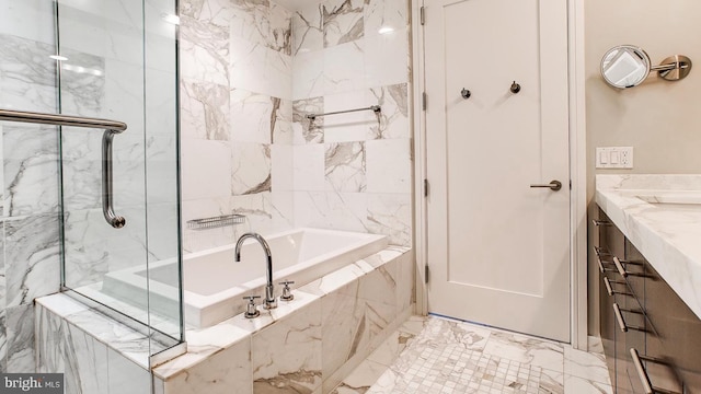 bathroom with marble finish floor, vanity, a marble finish shower, and a bath