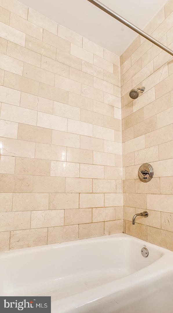 bathroom featuring bathing tub / shower combination