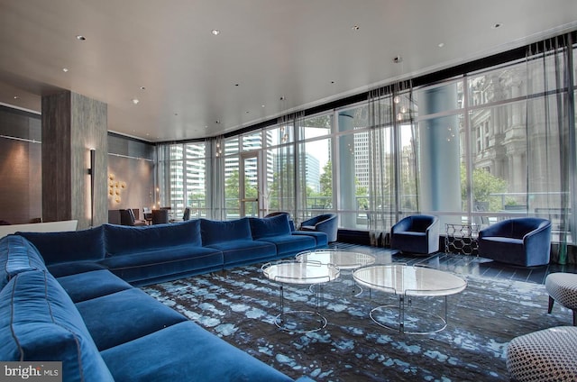 living area featuring floor to ceiling windows