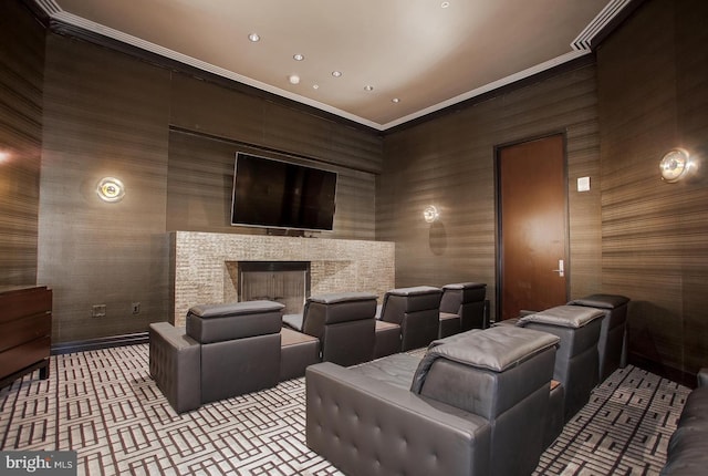 cinema room featuring a fireplace, ornamental molding, and recessed lighting