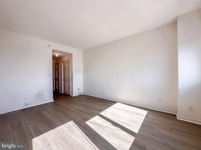 empty room featuring dark hardwood / wood-style floors