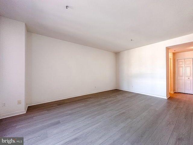 unfurnished room featuring wood-type flooring