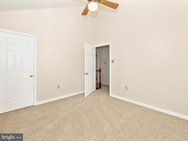 unfurnished bedroom with light carpet, ceiling fan, and baseboards