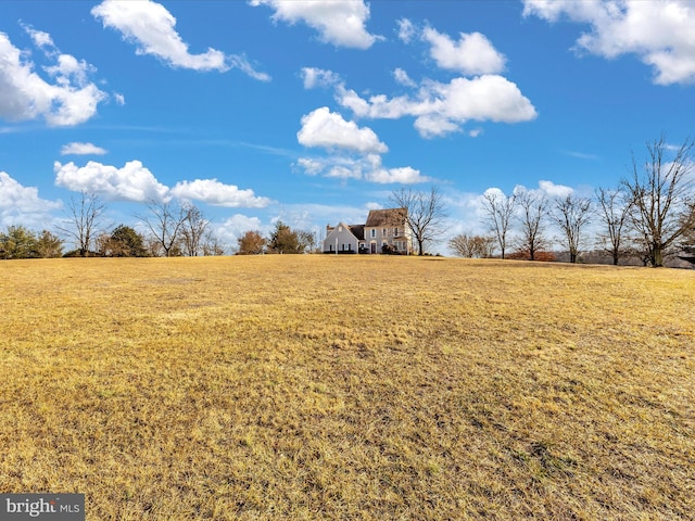 view of yard with a rural view