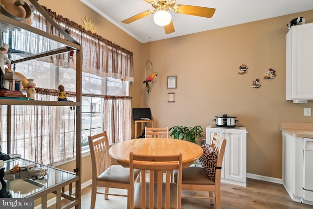 dining space featuring ceiling fan and light hardwood / wood-style floors