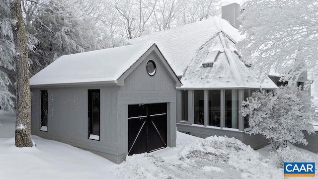 view of snow covered garage