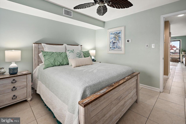 bedroom with light tile patterned floors, ceiling fan, visible vents, and baseboards