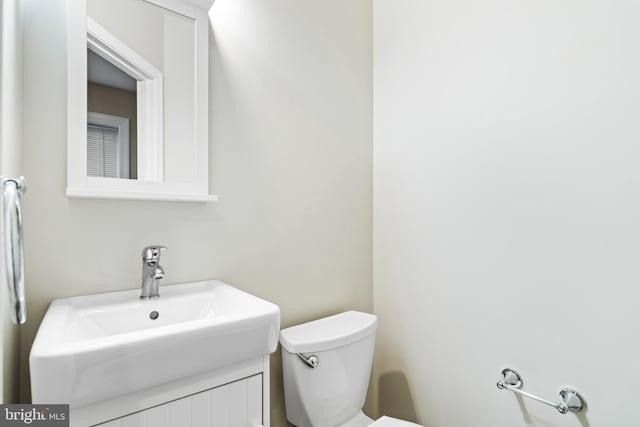 bathroom with sink and toilet