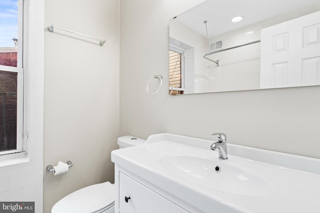 bathroom with vanity and toilet