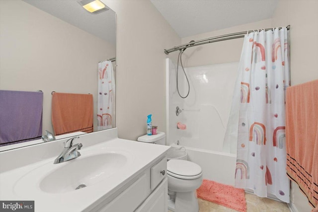 bathroom featuring toilet, shower / bath combo with shower curtain, a textured ceiling, and vanity