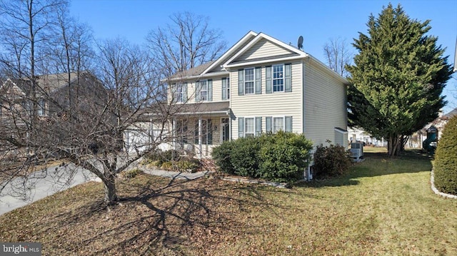 view of front of house featuring a front yard and cooling unit