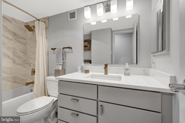 full bathroom with shower / tub combo with curtain, vanity, and toilet