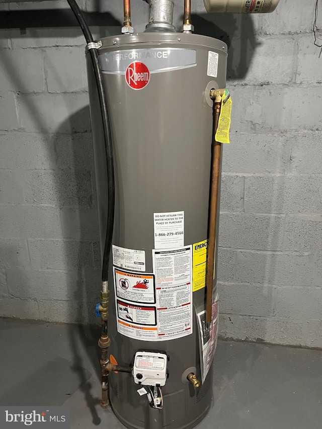 utility room featuring gas water heater