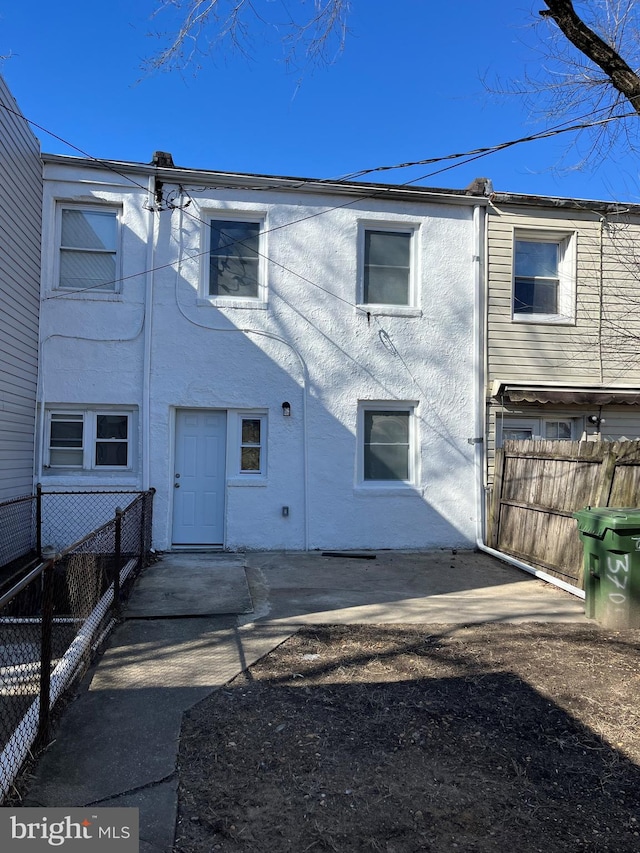 back of house with a patio