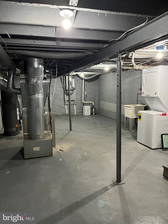 basement featuring gas water heater and sink