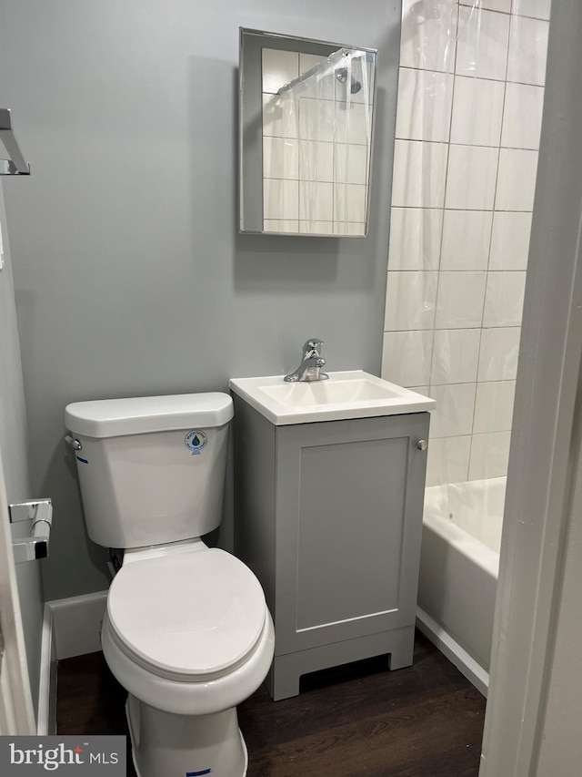 bathroom with vanity, toilet, and wood-type flooring