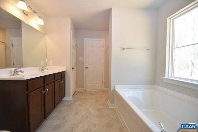 bathroom featuring a bathing tub and vanity