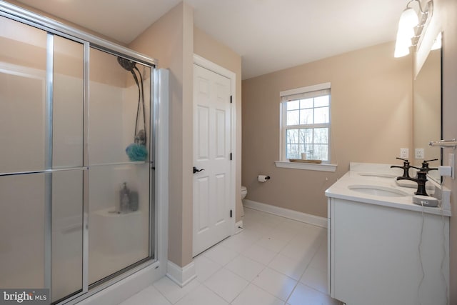 bathroom with toilet, an enclosed shower, and vanity