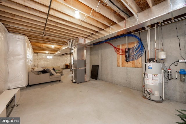 basement featuring heating unit and water heater