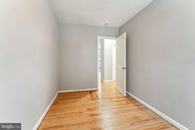 spare room with light hardwood / wood-style floors