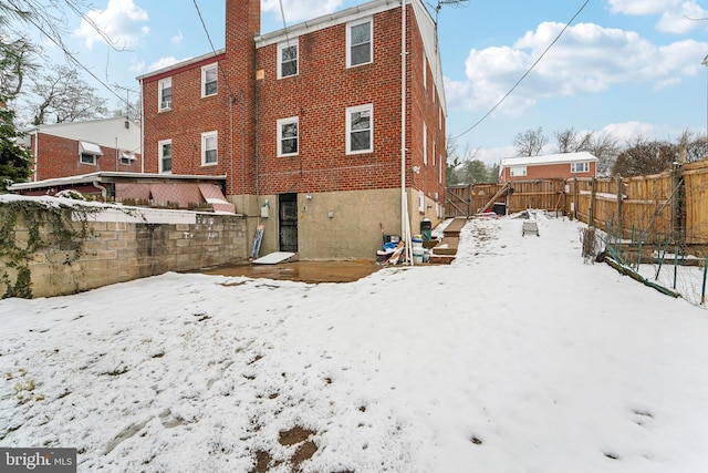 view of snow covered house