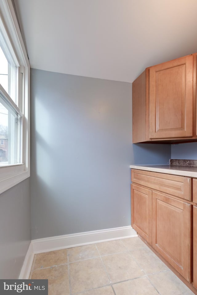 interior space with light tile patterned flooring