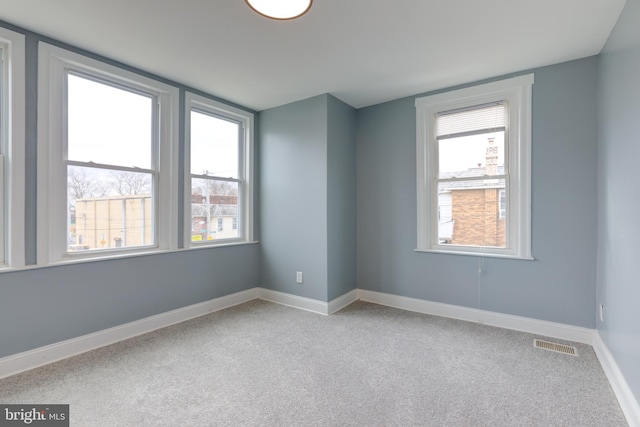 empty room with light colored carpet