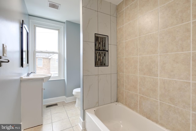 bathroom featuring tile patterned flooring, vanity, and toilet