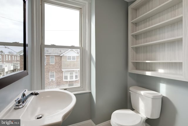 bathroom featuring sink and toilet