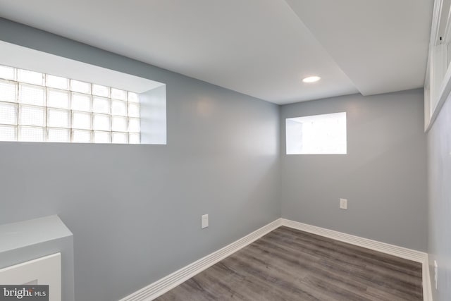 basement with dark wood-type flooring