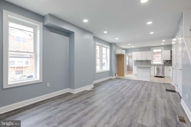 unfurnished living room with light wood-type flooring