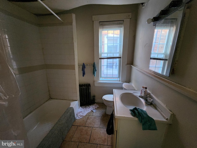 bathroom featuring radiator heating unit, toilet, and vanity