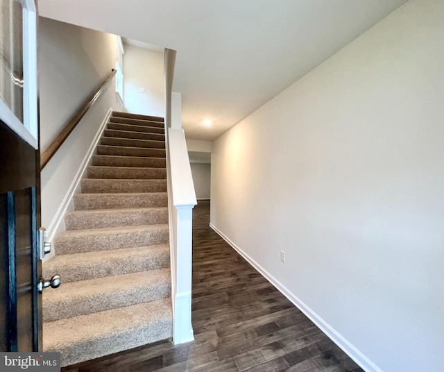 staircase featuring hardwood / wood-style flooring