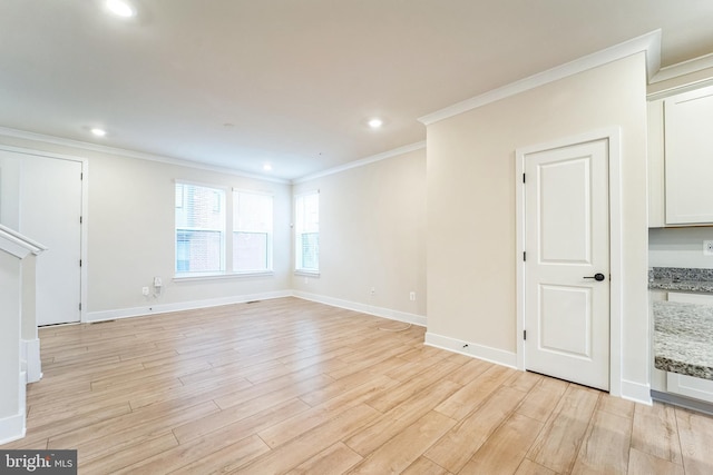 unfurnished living room with crown molding, recessed lighting, baseboards, and light wood-style floors