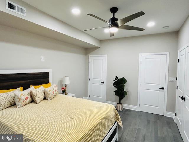 bedroom featuring dark wood-type flooring and ceiling fan