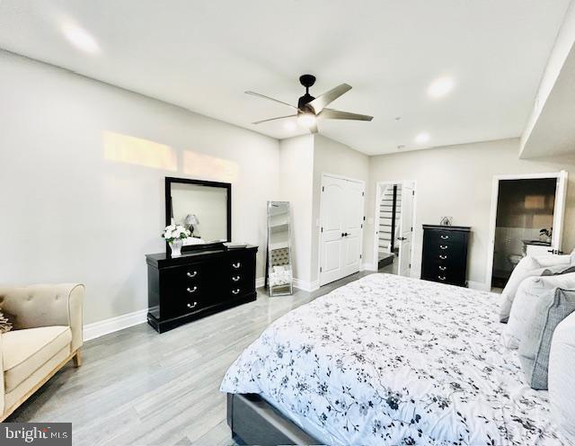 bedroom featuring wood-type flooring and ceiling fan