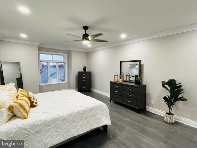 bedroom featuring crown molding, dark wood-type flooring, and ceiling fan