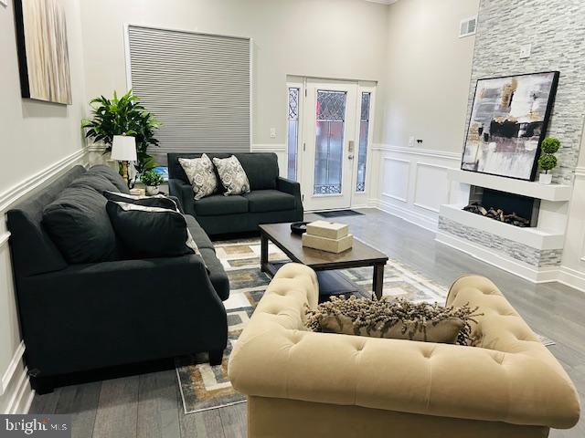 living room featuring hardwood / wood-style flooring and a fireplace