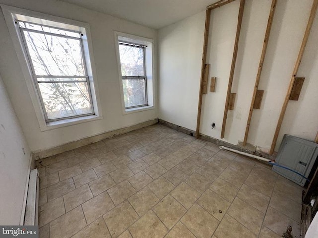 empty room with a baseboard heating unit