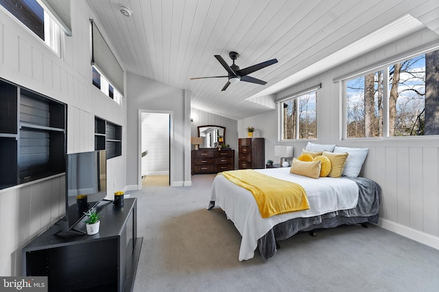 carpeted bedroom with a ceiling fan, wood ceiling, vaulted ceiling, and baseboards