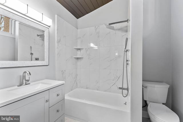 bathroom with lofted ceiling, shower / bath combination, vanity, and toilet