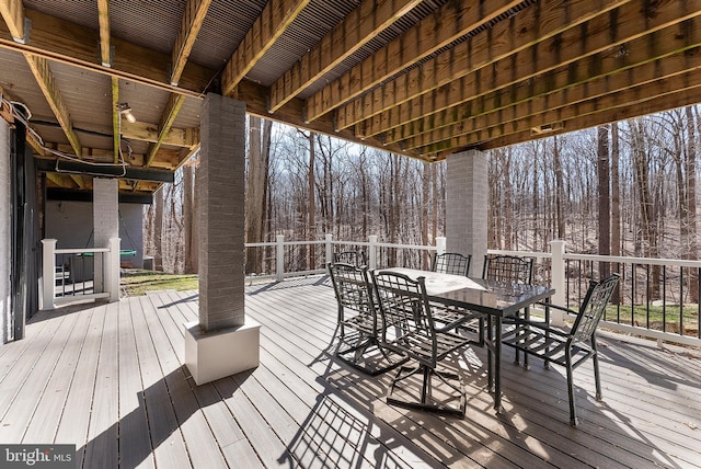 wooden deck with outdoor dining space