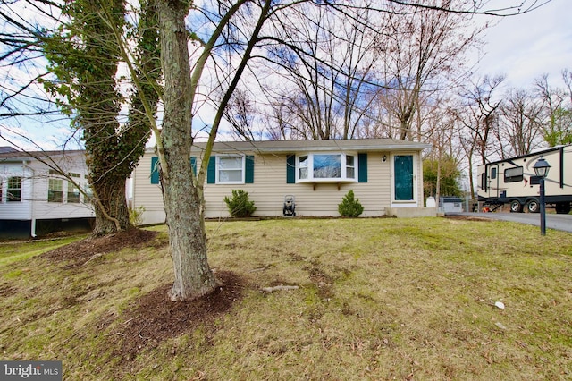 view of front of property with a front lawn