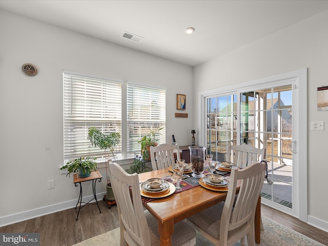 dining area with hardwood / wood-style flooring