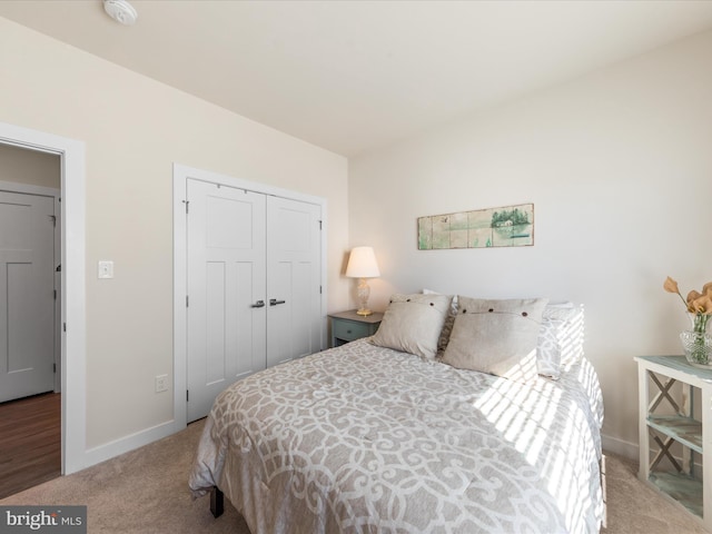 carpeted bedroom with a closet