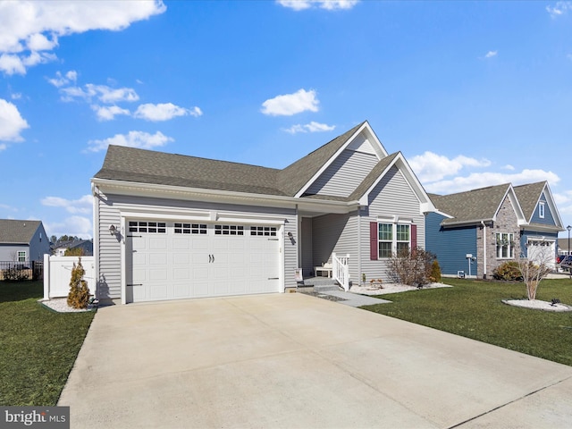 view of front of home featuring a garage and a front lawn