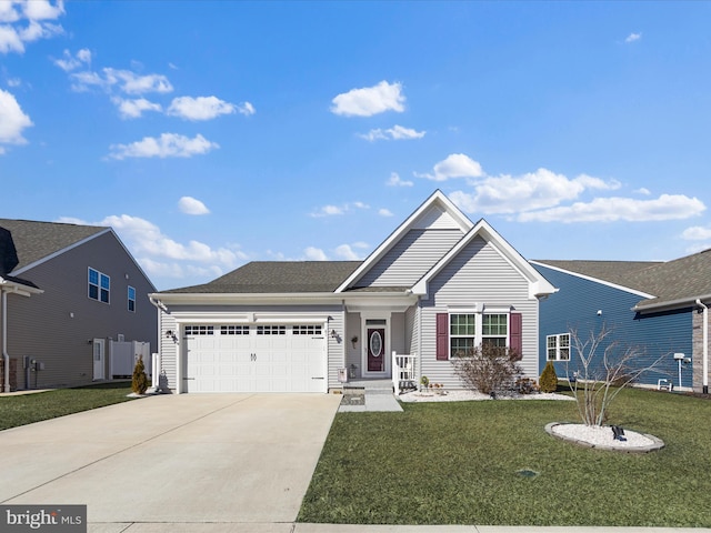 view of front of property featuring a garage and a front yard