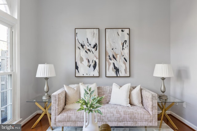 living room with wood finished floors and baseboards